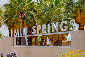 Picture of palm trees and Palm Spring signage