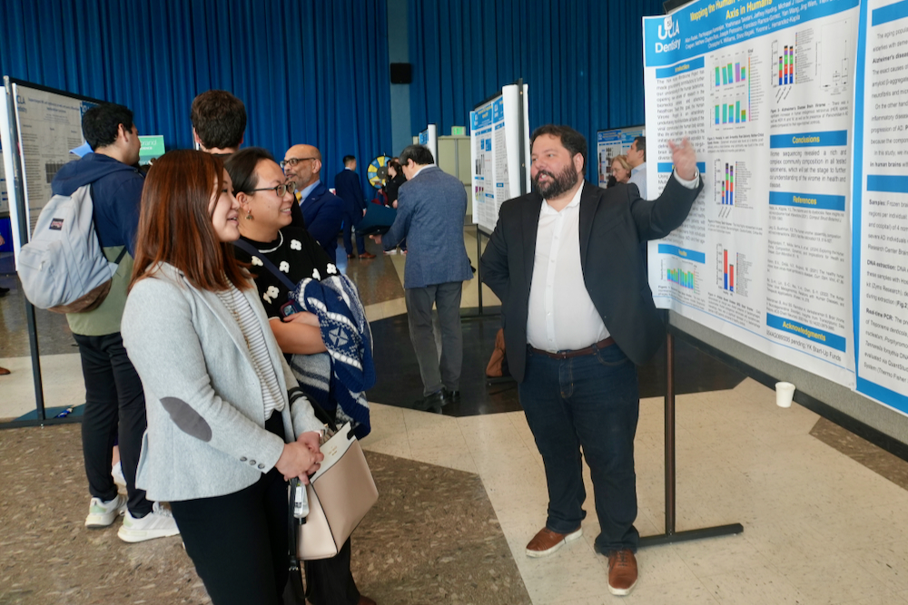 Man explaining research poster