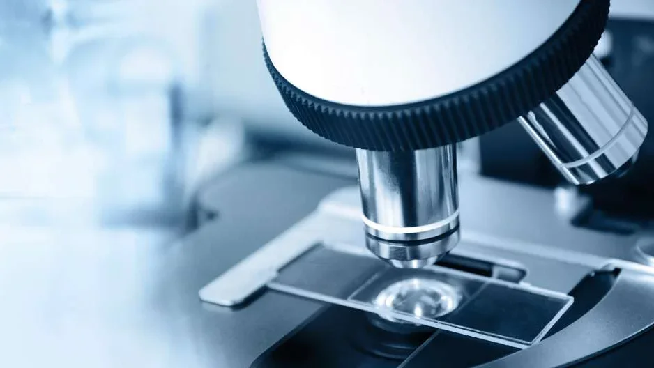 Close up of powerful microscope looking at slide sample 