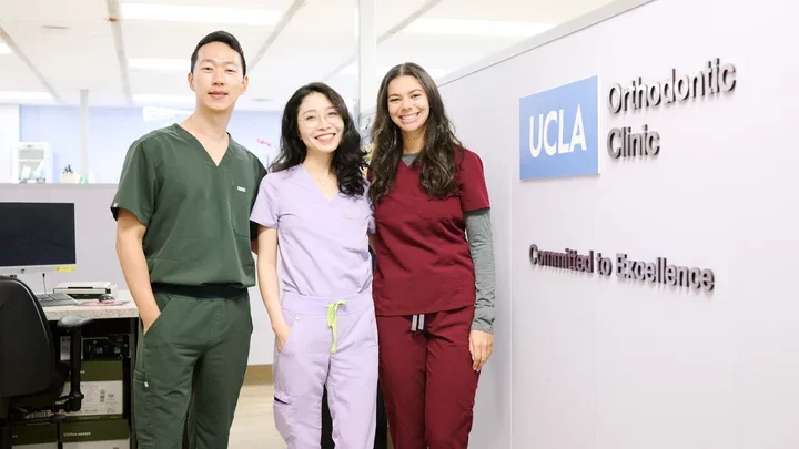 three smiling orthodontics residents