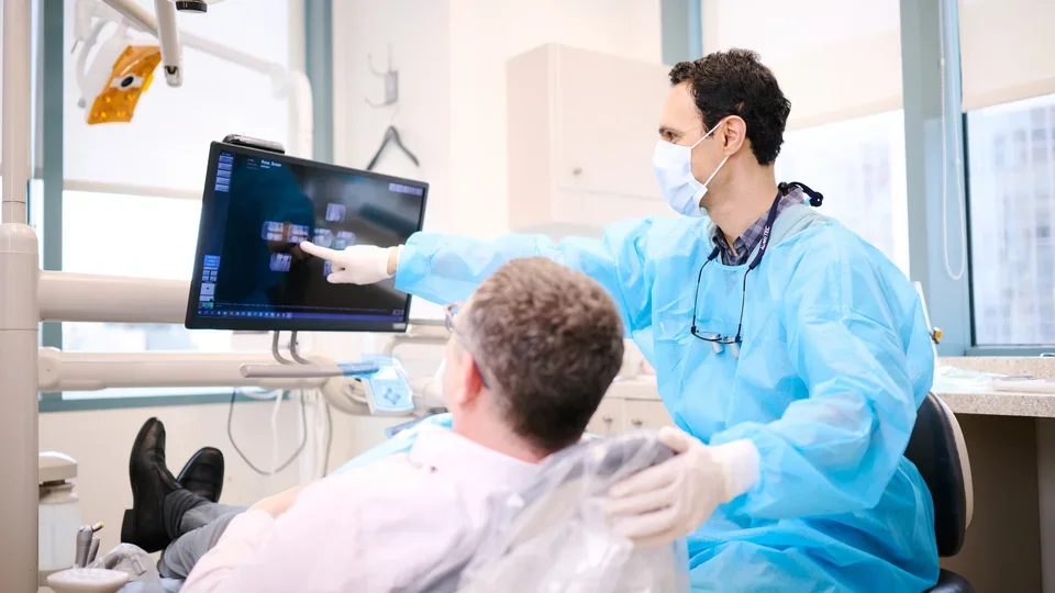 Dentist explaining x-rays to patient