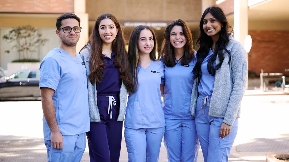 A group of UCLA dental students gathers to take a photo.