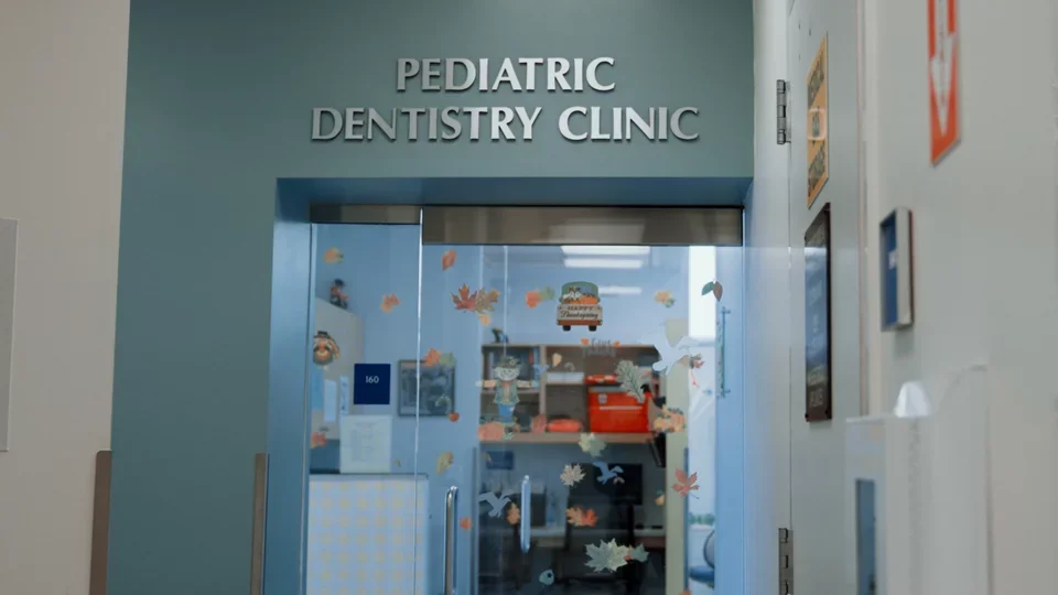 Blue awning reading "Pediatric Dentistry Clinic"