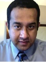 Bhoopathi Headshot wearing grey top