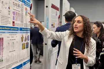 Rachel Kulchar presents an academic research poster