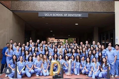 88 dental students in blue scrubs