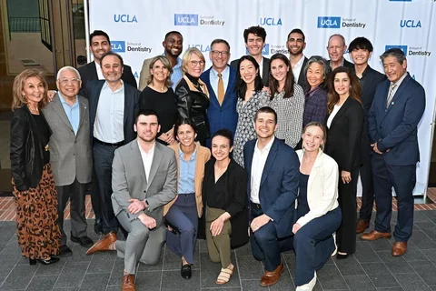 Group of people in front of sign