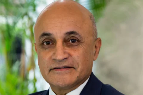 Dr. Kapila in suit and tie headshot