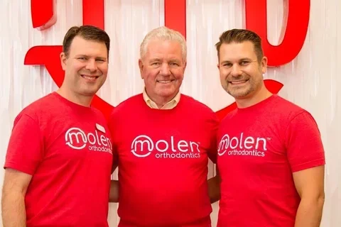 Dr. Bruce Molen, center, with his sons