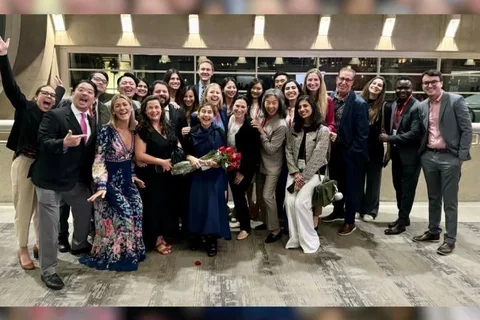 Group of people celebrating in a hotel lobbby