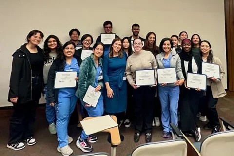 Group of people holding certificates