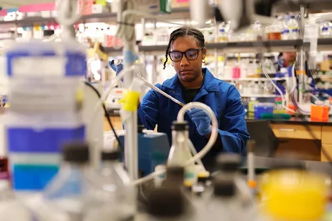 A research student working in a dentistry lab.