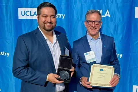 Dr. Mark Ortega and Dr. Paul Krebsbach pose against a blue backdrop