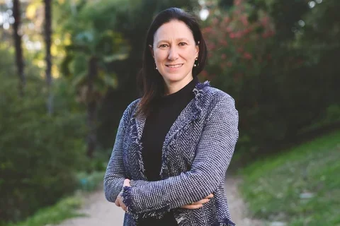 Dr. Flavia Pirih with arms crossed