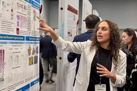 Rachel Kulchar presents an academic research poster