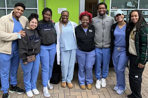 Members of the Student National Dental Association at UCLA smiling.