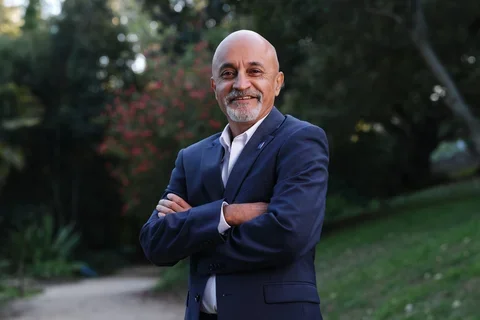 Dr. Sunil Kapila with arms folded