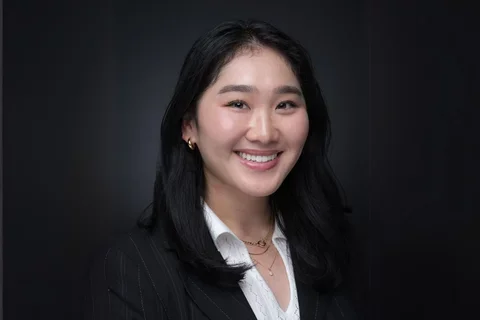 Tiffany chen, smiling in a black blazer