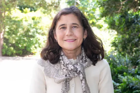 Dr. Yvonne Hernandez-Kapila standing in a garden