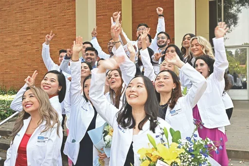 A celebratory moment for the PPID cohort of 2026 following the School's White Coat Ceremony in July 2024.