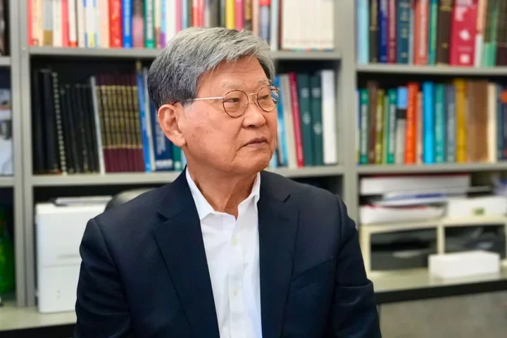 Portrait of UCLA Dentistry Dean Emeritus No-Hee Park faculty member in office with bookshelves, representing academic leadership and dental research expertise.