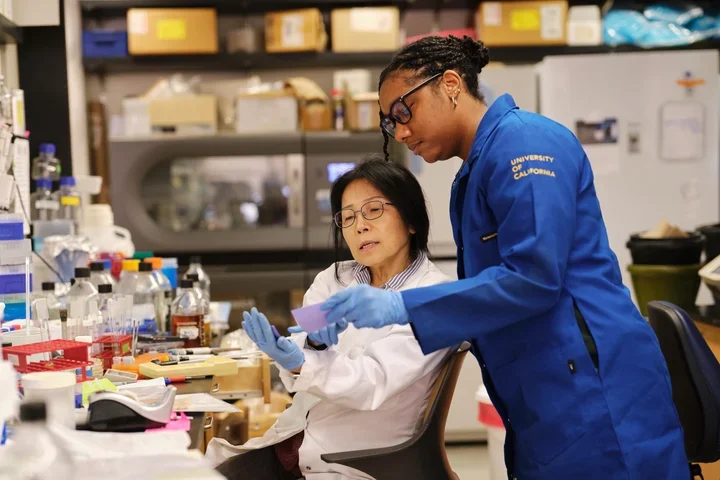 professor mentoring student in lab