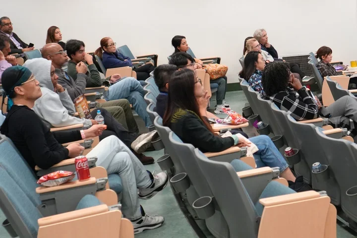 people sitting in an auditorium