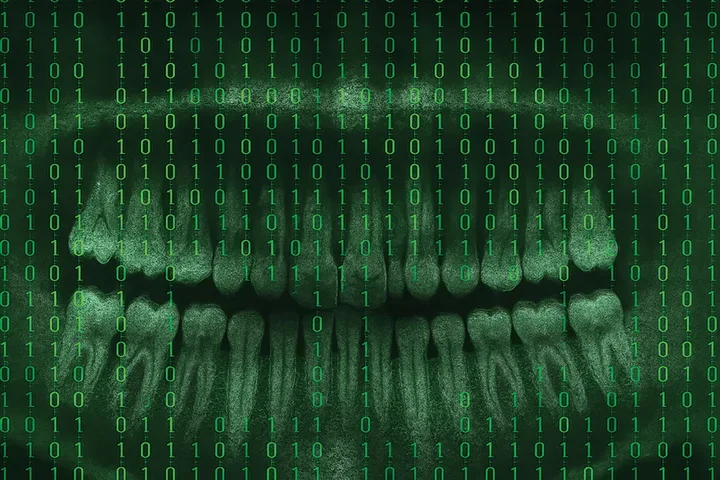 An neon grreen dental x-ray with binary numbers across the page.