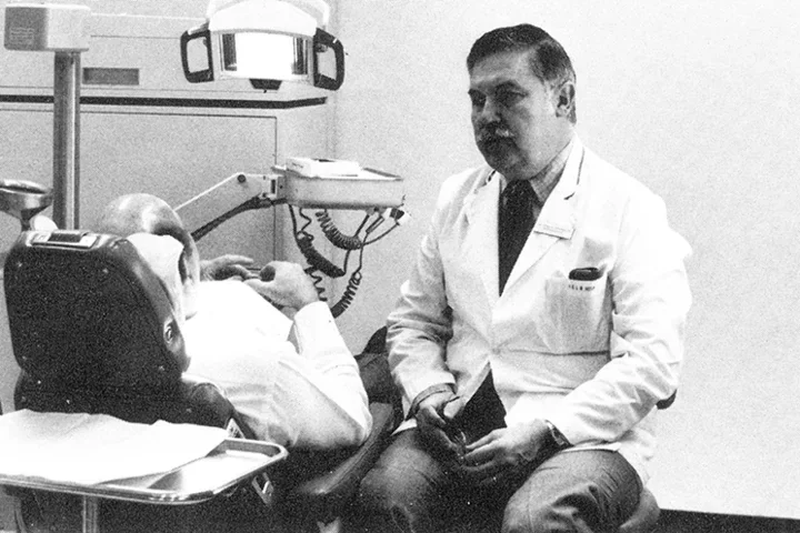 Dr. Fermin Carranza conversing with a patient