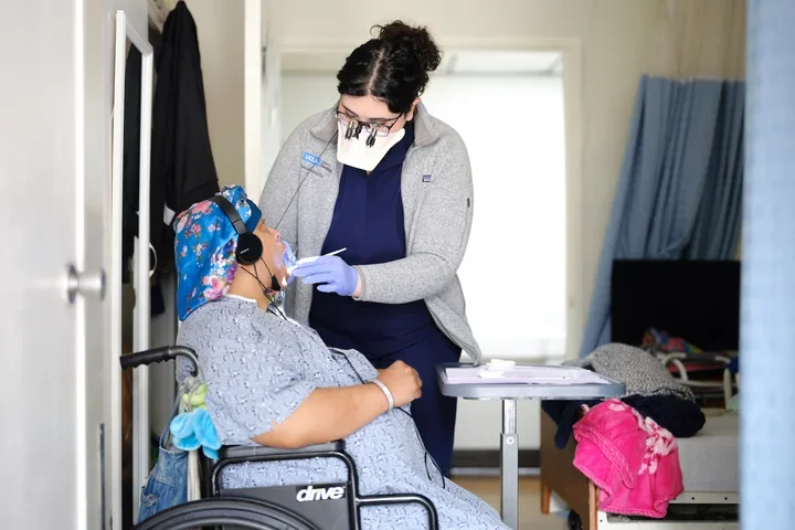 Dental care to a patient in a wheelchair
