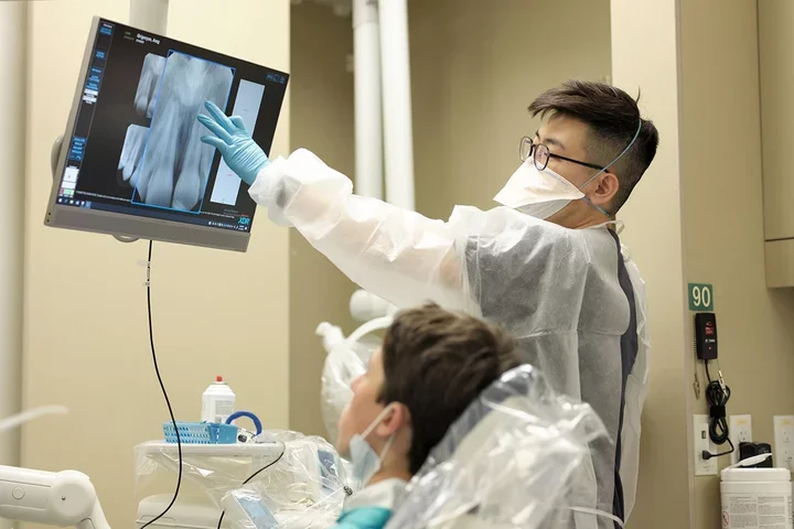 An endodontics resident with a patient.
