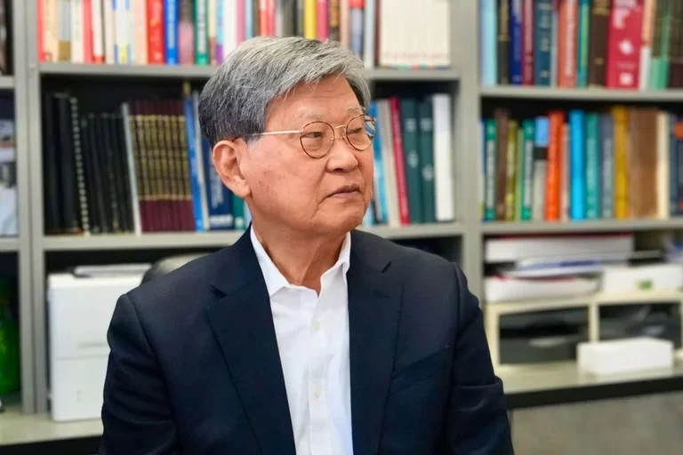 Portrait of UCLA Dentistry Dean Emeritus No-Hee Park faculty member in office with bookshelves, representing academic leadership and dental research expertise.