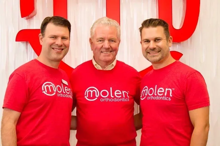 Dr. Bruce Molen, center, with his sons