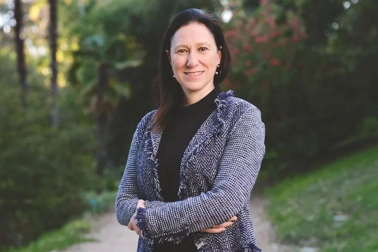 Dr. Flavia Pirih with arms crossed