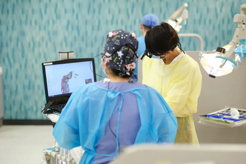 Two dental practitiones using intraoral scanning