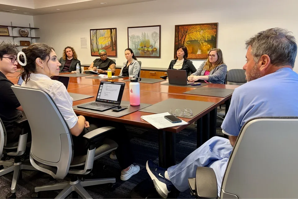 people sitting at conference table