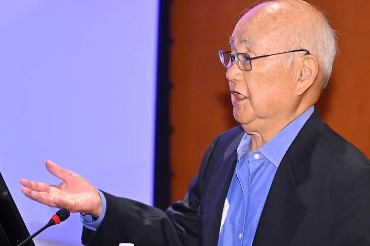Dr. Henry H. Takei stands at the podium during the inaugural Dr. Henry H. Takei Endowed Periodontal Symposium at the UCLA School of Dentistry.