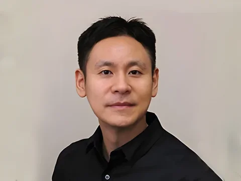 Dr. Min Lee against a tab background