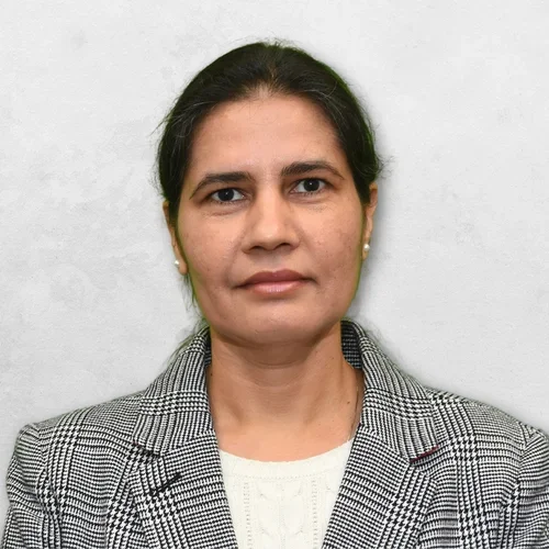 Bhumika Shokeen is wearing a black, gray and white strip sport coat.