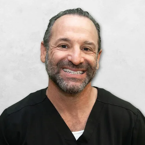 Dr. Bradley Matthew is wearing a black medical scrubs.