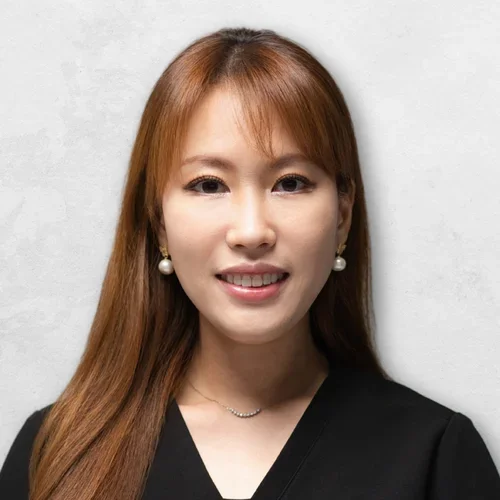 Dr. Ji is wearing black medical scrubs.