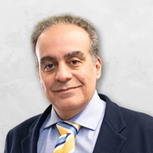 Dr. Farr in a suite with a UCLA color tie.