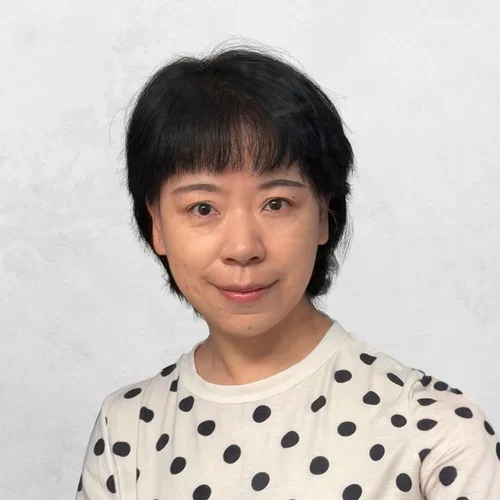 Dr. Fang Wei in a polka-dot shirt