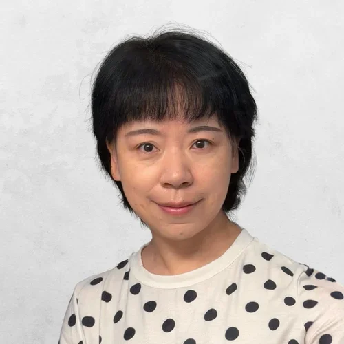 Dr. Fang Wei in a polka-dot shirt
