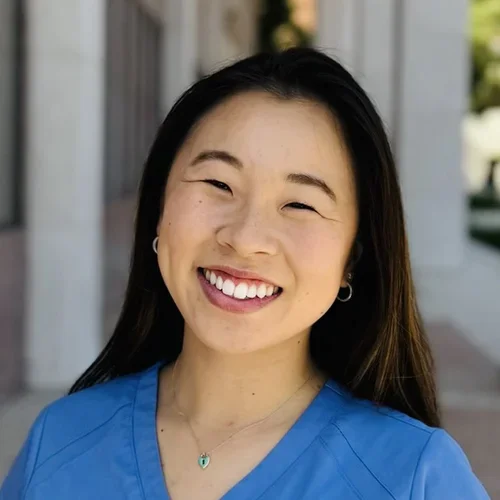 Irina is smiling in a headshot