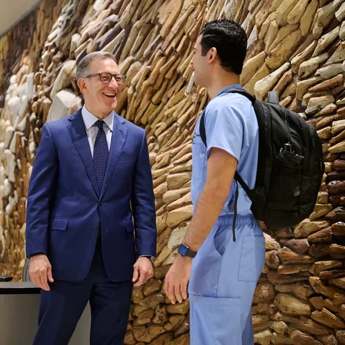 Paul Krebsbach talking to a student