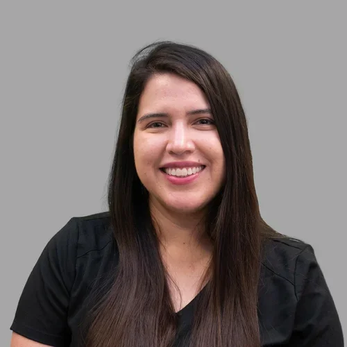 Dr. Damaris Arriola Zarate is wearing black scrubs.