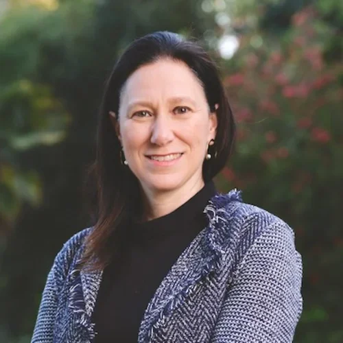 Dr. Flavia Pirih with arms crossed