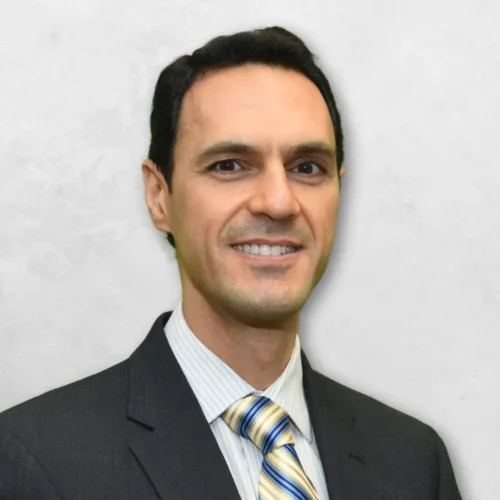 Dr. Zaher George Jabbour is wearing a suit and tie.