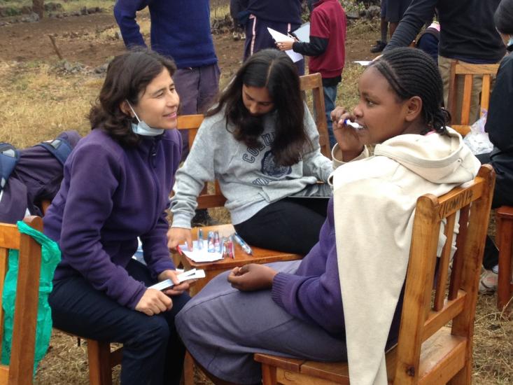 Yvonne Hernandez-Kapila (left) helping with survey work in Kenya